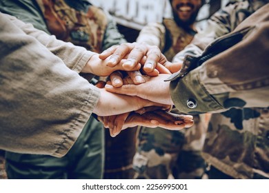 Soldier, team building or hands in a huddle for a mission, strategy or motivation on a paintball battlefield. Goals, collaboration or army people with support in a partnership or military group - Powered by Shutterstock