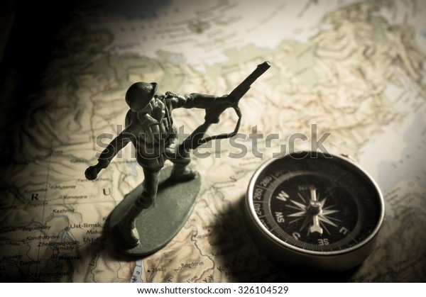 Soldier toys with compass on map