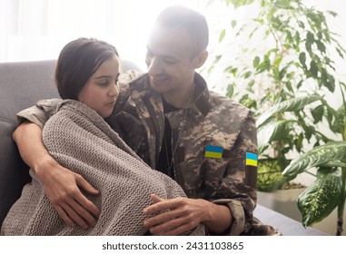 Soldier in Ukrainian military uniform hugging his daughter. Family reunion - Powered by Shutterstock