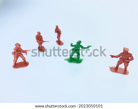 A soldier is under siege. Selected focus for green soldier