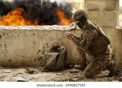 Soldier in uniform with drone controller inside abandoned building during military operation - Powered by Shutterstock