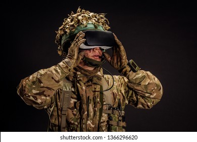 Soldier Use A VR Glasses For Combat Simulation Training. War, Army, Technology And People Concept.