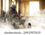 Soldier using laptop inside building during military operation