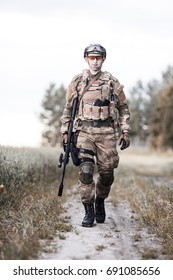 A Soldier Is Walking Along The Road