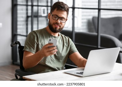 Soldier in wheelchair using mobile phone at home - Powered by Shutterstock