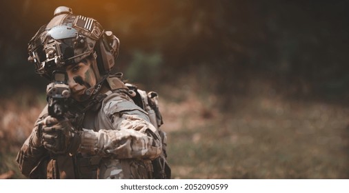 Soldier Woman Action With Gun On Hand Holding To Protect, Survey Around Safety Area In Soldier Mission With White Smoke Background.