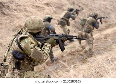 Soldiers during combat. Ukrainian soldiers with assault rifle take part in tactical exercises.