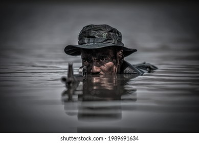 Soldiers With Gun Is Hiding In The River. War, Soldier Army, Gun And Hostage Rescue Concept.