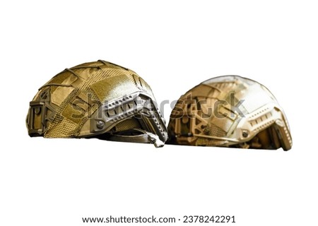 The soldier's helmet from the khaki military uniform set, as seen in the army clothing store, isolated on white background.