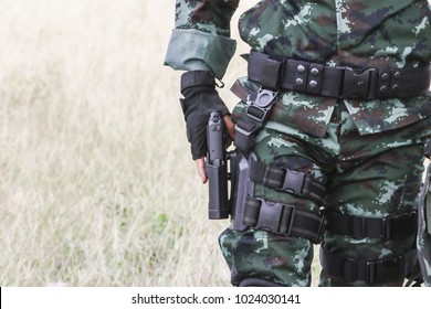 The soldiers are pulled out from the pistol holster.