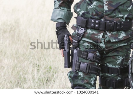 The soldiers are pulled out from the pistol holster.