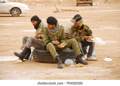 Soldiers Of The Rebel Army Have Lunch. Rebels Fight Against Gaddafi's Military Forces. Ajdabiya, Libya, April 7, 2011.