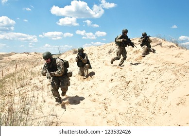 Soldiers Running Through The Desert