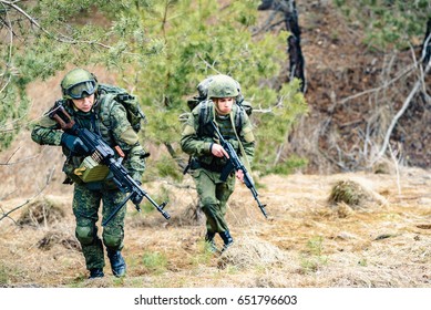 Soldiers Of The Russian Army March Through The Forest Belt During A Combat Operation