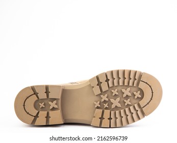 Sole For Shoes, Bottom View. Beige Shoe Sole Close-up Isolated On White Background. Place For Text. Element Of Boots. Concept Of Production Of Shoe Accessories.