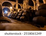 Solera system in old bodega, Andalusian wine cellar, process for aging different sherry wine in barrels, producing of jerez fortified wine, Jerez de la Frontera, Andalusia, Spain