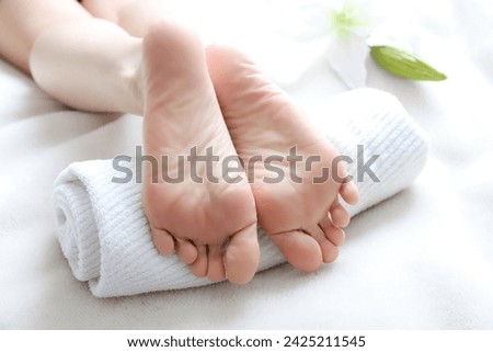 Soles of a lying woman's feet