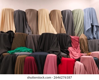 Solid Color Fabric Rolls on Display in Fabric Store.