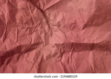 Solid colourful soft pink paint on crumpled eco friendly wrap paper texture background with space