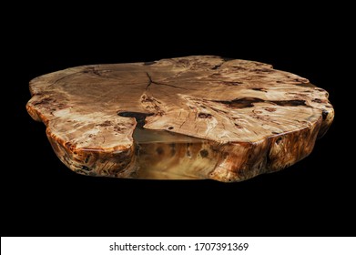 Solid elm countertop. Wood surface cross section of elm tree. Live slab. Isolated on a black. Woodworking, carpentry production. Furniture manufacture. Wooden table with epoxy resin filling.