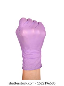 Solid Fist Or Anger Gesture In Latex Surgical Gloved Sign Against White Background. Hand In A Purple Latex Glove Isolated On White. Woman's Hand Gesture Or Sign Isolated On White.