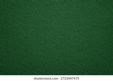 Solid green felt texture background with soft matte fibers