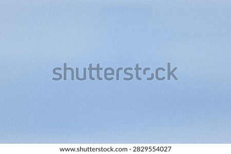 A solid light blue background featuring a soft grainy texture and a subtle, uniform lighting effect across the entire surface area.