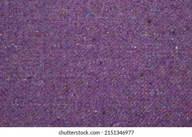Solid lilac background with woven texture. A sample of wool tweed fabric with speckles. 