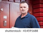 solid man checks the work of the intercom