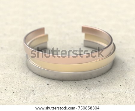Solid metal bracelet in three colors on a stone table. Mockup close-up