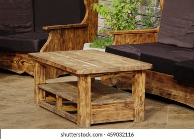 Solid Natural Wood Outdoor Handmade Table And Couch On The Terrace At Summertime