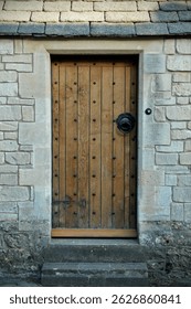 Solid oak door of a beautiful old house on a street in an English town