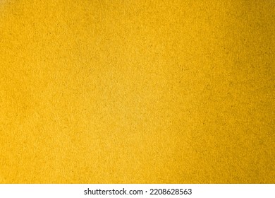 Solid Plain Yellow Color Gradation With Dark Black Blot Tone Paint On Recycled Blank Cardboard Box Craft Paper Texture Background Minimal Style With Space