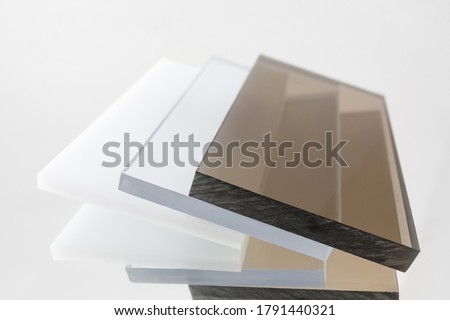 Solid Polycarbonate Sheet. Brown, white, transparent. Acrylic Plastic glass