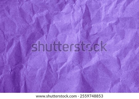 Solid purple paper texture isolated as background with creased and crumpled papier texture. Recycled, handmade, wrapping paper. Arts and crafts, packaging, crushed papyrus sheet. Card stock, drawing.