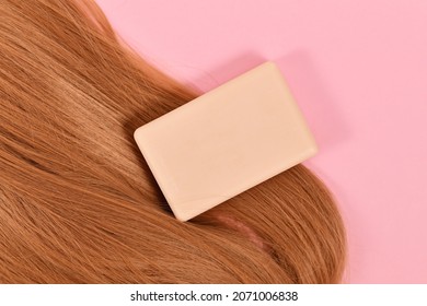 Solid Shampoo Bar With Healthy Hair On Pink Background