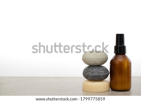 Solid Shampoo and conditioner bars and a glass bottle of deodorant