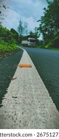 solid side line on road meanwhile truck is driving on road 
