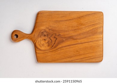 A solid wood cutting board with a handle, showcasing natural grain patterns and a knot on one side isolated on plain white background 