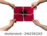 Solidarity and togetherness in Albania, people helping each other, Albania flag on 4 paper pieces, unity and help idea, support and charity concept, union of society