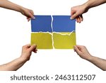 Solidarity and togetherness in Ukraine, people helping each other, Ukraine flag on 4 paper pieces, unity and help idea, support and charity concept, union of society
