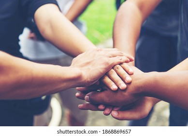 Solidarity unite people hands together community teamwork. Hands of spirit team working together outdoor. Unity strong handshake with people or agreement of feeling or happy diverse education action - Shutterstock ID 1868869657