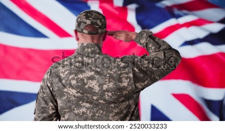 Solider Saluting In Front Of The British Flag