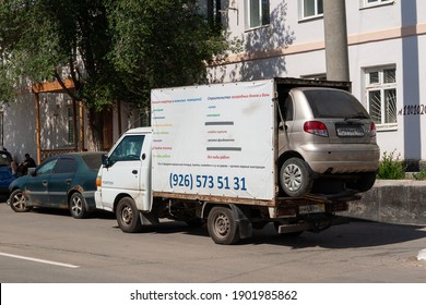 Sol-Iletsk, Russia, 08.27.2020. A Small Truck Carries A Small Car. The Daewoo Matiz Car Is In The Back Of A Hyundai Porter Truck.