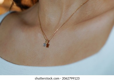 Solitaire diamond necklace with girl wearing white t shirt, concept photo idea