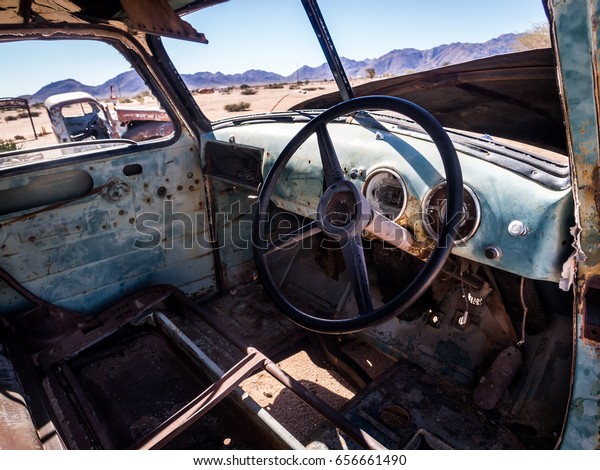 SOLITAIRE, NAMIBIA - JUNE 18,\
2016: Old Ford car wreck left in Solitaire on the Namib Desert,\
Namibia.