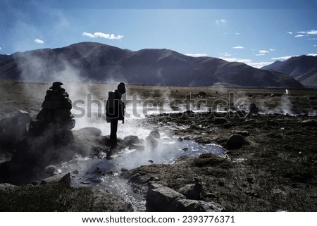 Solitary Explorer Amidst Mystical Steam - Tibetan Geothermal Hot Springs