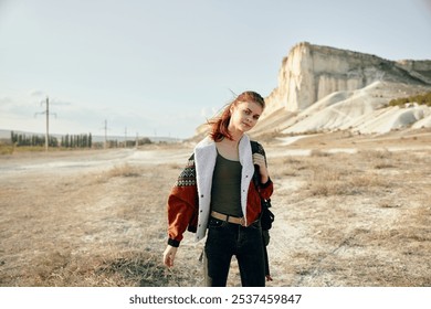 solitary figure in desert landscape with mountain backdrop under clear blue sky - Powered by Shutterstock