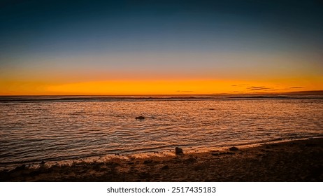 Solitary figure stands mesmerized by Cook Islands sunset. Fiery orange and pink hues paint the sky above calm ocean. Peaceful serenity. Nature's masterpiece on full display. - Powered by Shutterstock