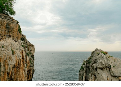 A solitary fishing boat navigates the vast, calm ocean under a pale sky. The minimalistic scene conveys solitude, tranquility, and the endless expanse of the sea. - Powered by Shutterstock